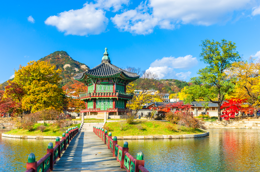 best countries to visit in October, Shrine in South Korea with Autumn colours