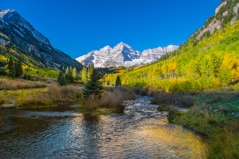best places to visit in North America in October, Maroon Bells mountains and lake in Colorado in Fall
