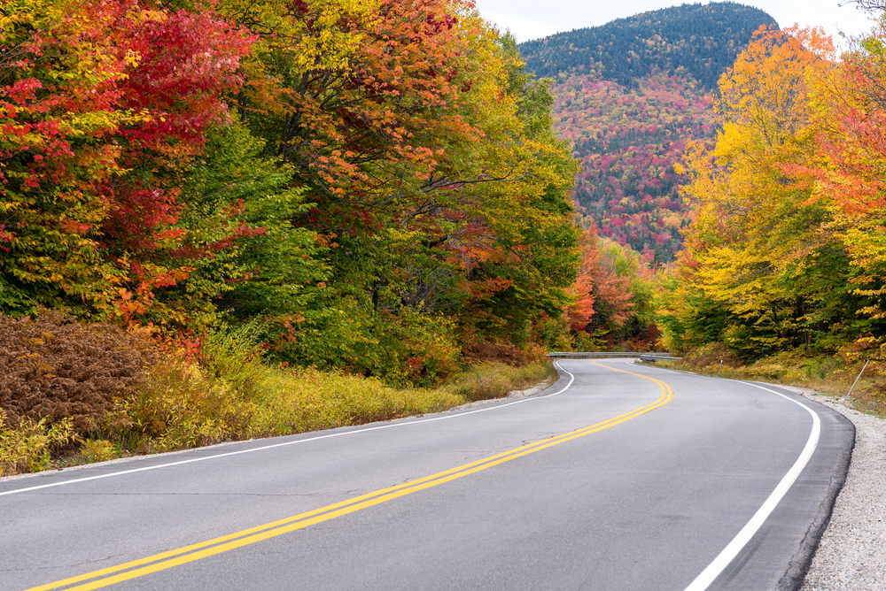 best places to visit in North America in October, road in New Hampshire with fall colours in October