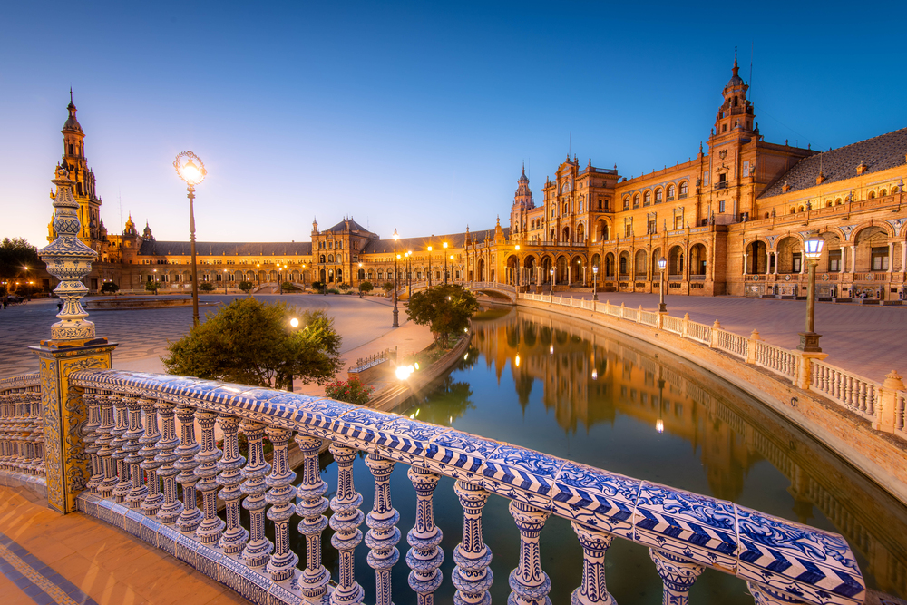 best places to visit in Europe in October, plaza in Seville in evening golden light