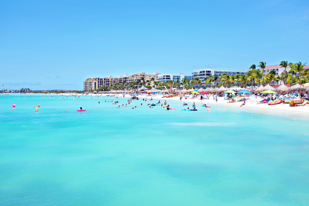 best Caribbean islands to visit in October, palm beach with tourists