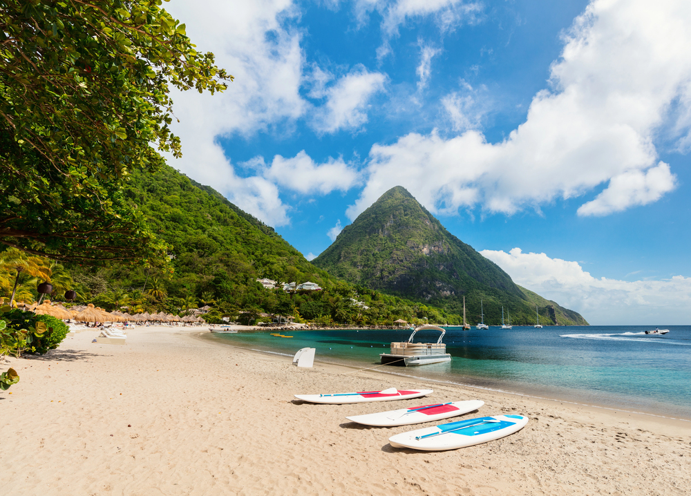 best Caribbean islands to visit in October, beach view of the Pitons in St Lucia