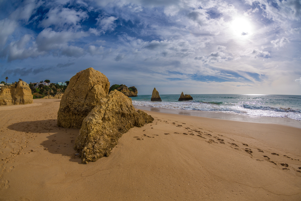 Empty Algarve beach in winter, warm places to visit in December in Europe