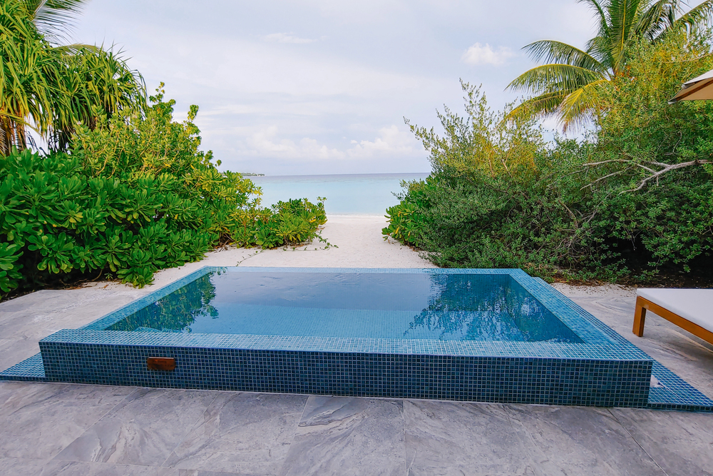 swimming pool on beach in the Maldives best places to visit in Asia in November,