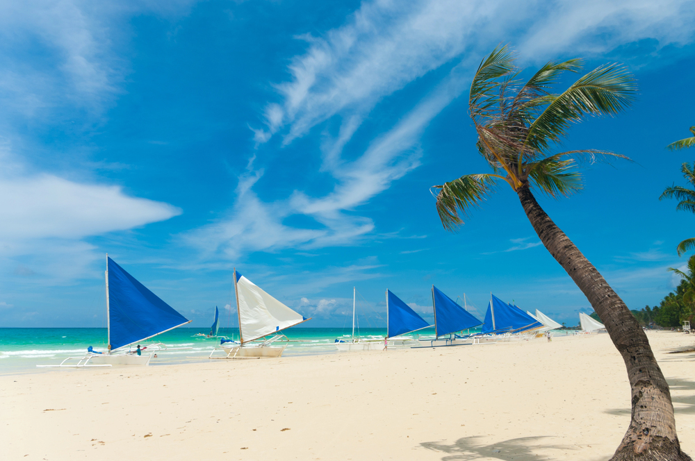 Boracay Beach and boats, the Philippines, best countries to visit in December,