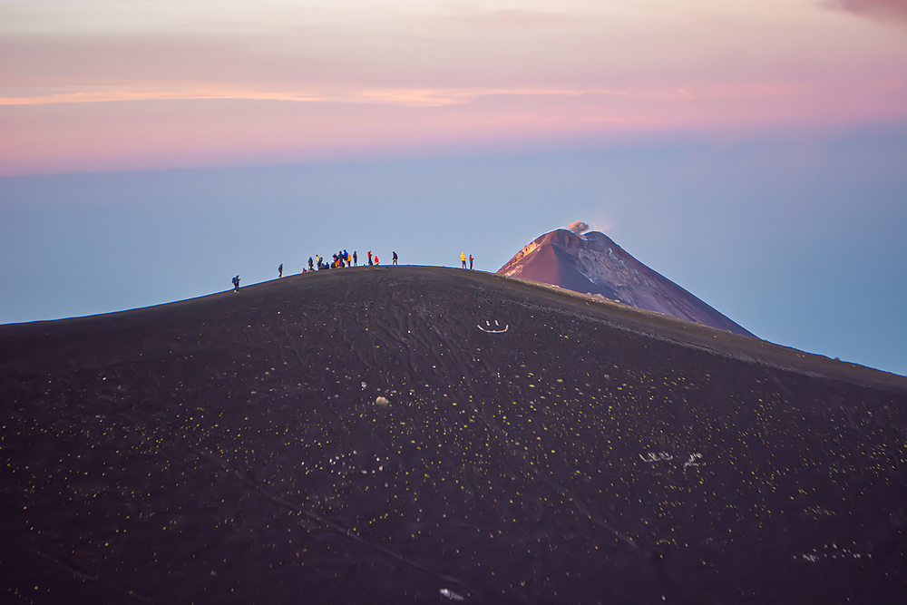 people hiking Acatenango volcano, best countries to visit in February