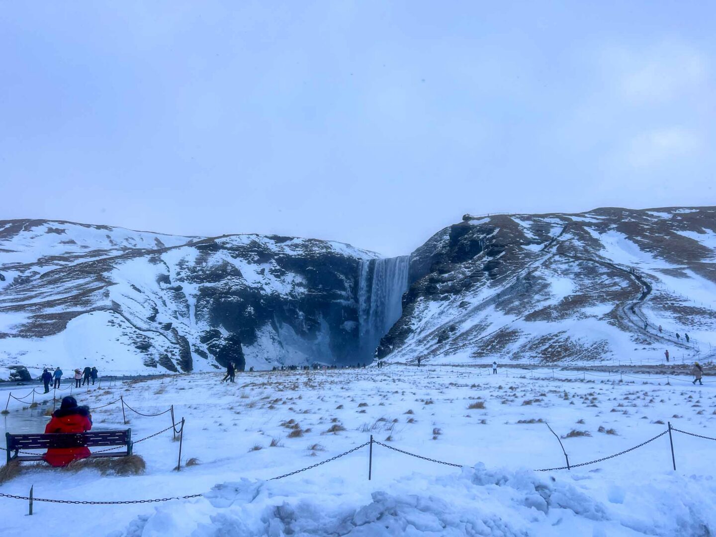 Iceland waterfall in snow and ice in February, best countries to visit in February